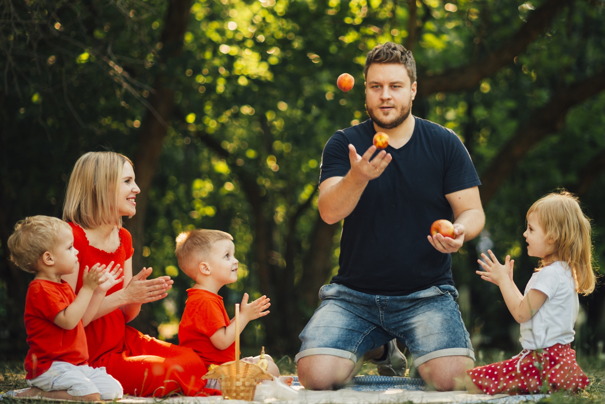 father-juggling-oranges-front-his-family